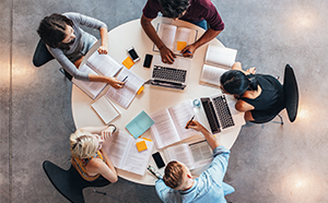 College students studying financial documents
